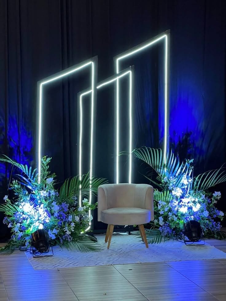 a chair next to plants and lights corporate photography